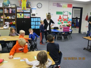 Levi telling about the bird feeder ornaments he created to sell in his neighborhood.